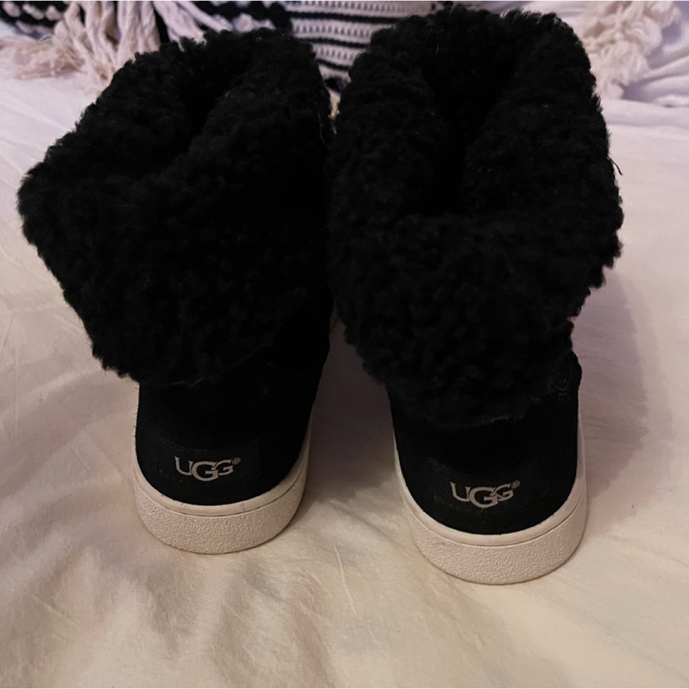 UGG black Chuck Taylor–inspired boots.